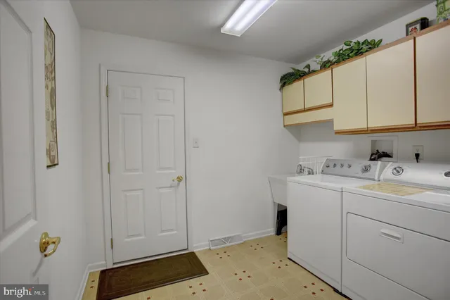 a bed room with a bed and a chair