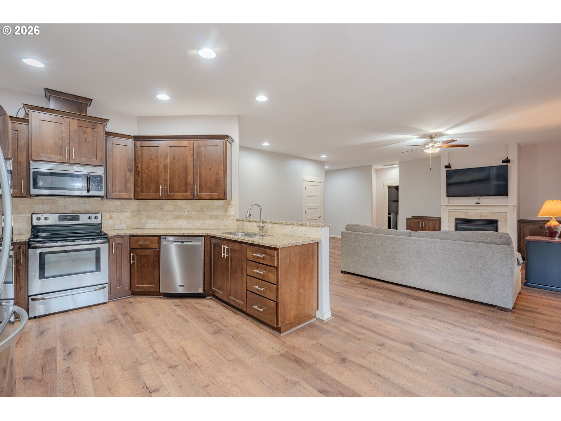 2156 Southwest 14th Drive Gresham, OR 97080 - Photo 14 of 48 a large kitchen with stainless steel appliances