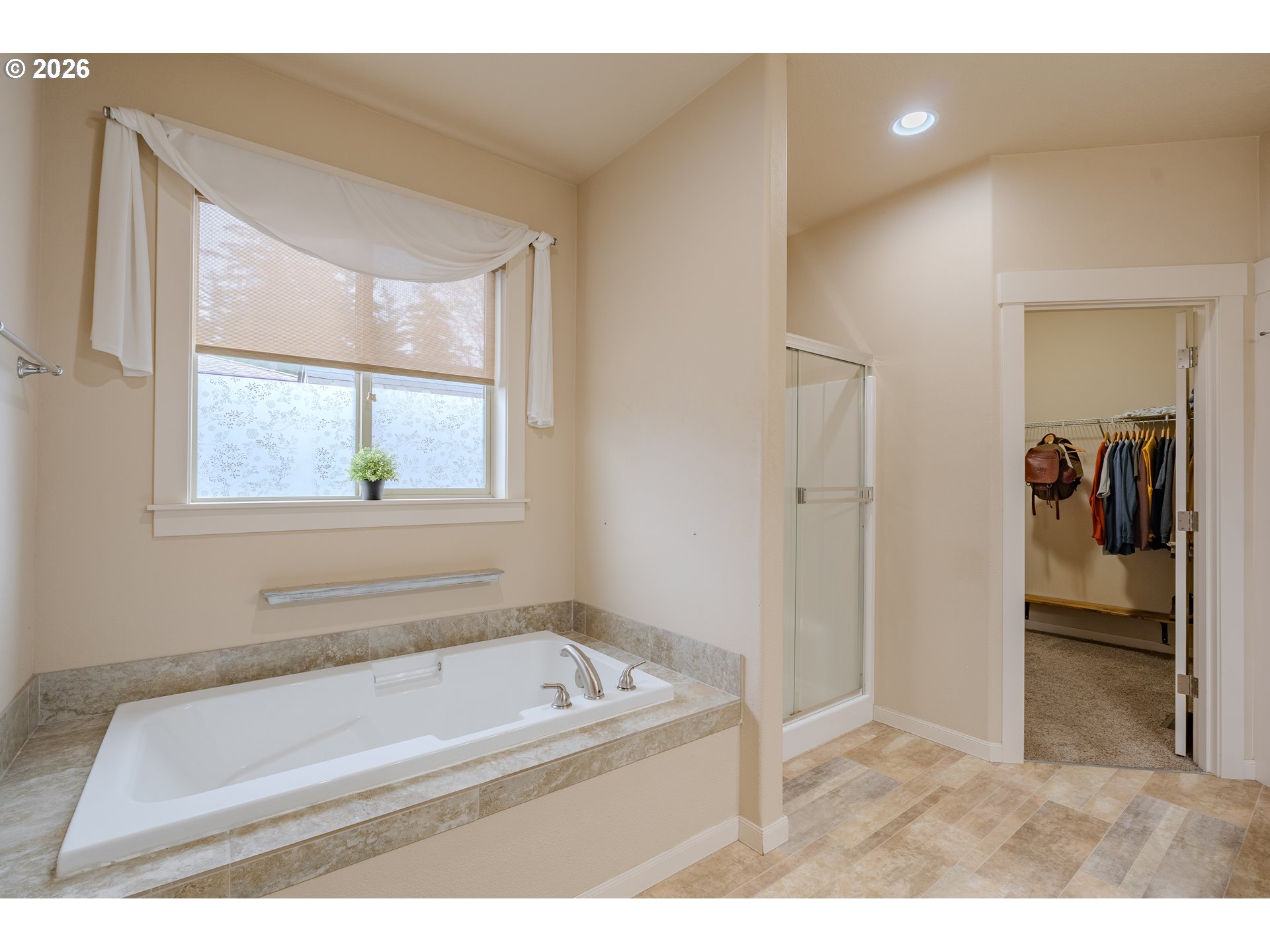 2156 Southwest 14th Drive Gresham, OR 97080 - Photo 33 of 48 a bathroom with a tub a sink and a window