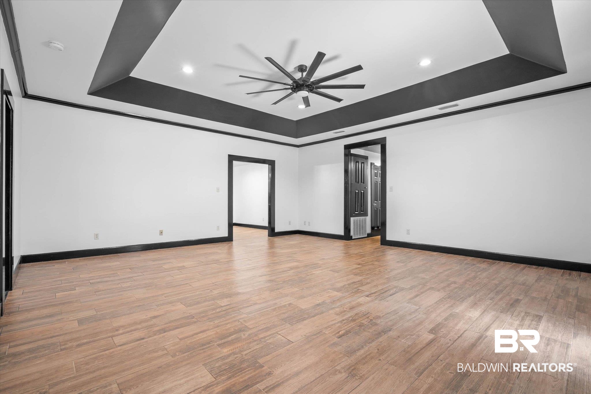 3216 Bay Booster Club Road Theodore, AL 36582 - Photo 4 of 46 Unfurnished room featuring a ceiling fan, a tray ceiling, light wood-type flooring, and recessed lighting