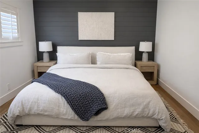 a bedroom with a bed and window