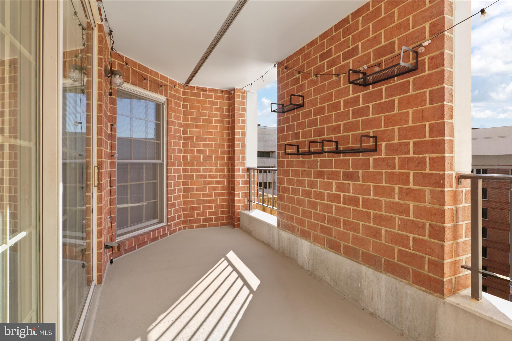 1230 23rd Street Northwest, Unit 918 Washington, DC 20037 - Photo 20 of 30 a view of a balcony with wooden floor and a bathtub