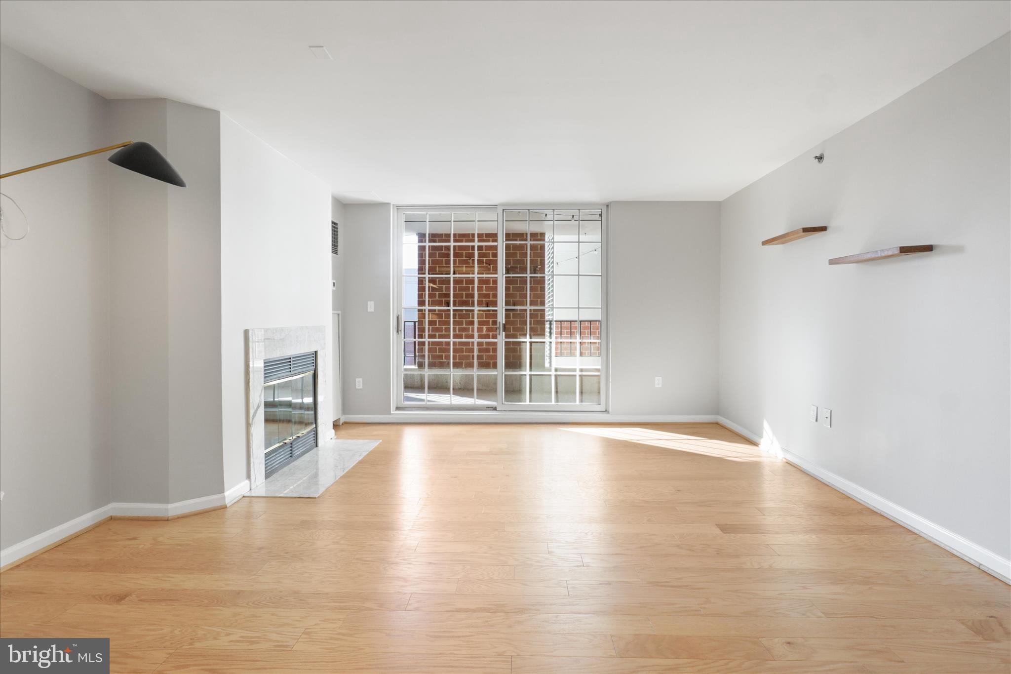 1230 23rd Street Northwest, Unit 918 Washington, DC 20037 - Photo 6 of 30 a view of an empty room with a window and wooden floor