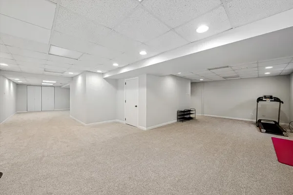 a room with gym equipment and a table
