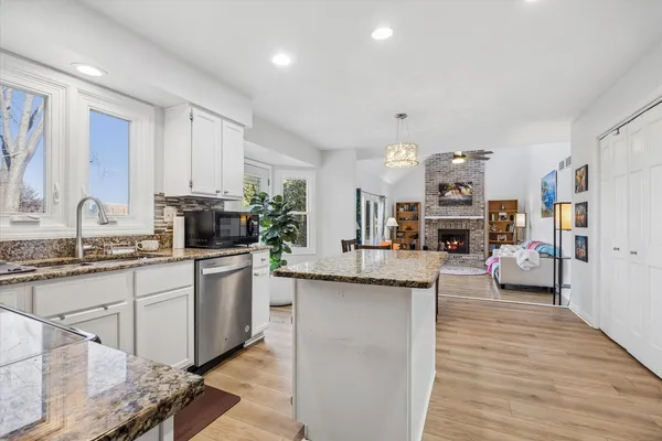 a kitchen with cabinets a sink and appliances