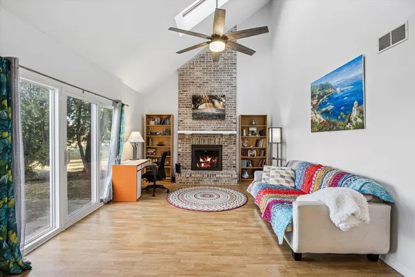 a living room with furniture and a fireplace