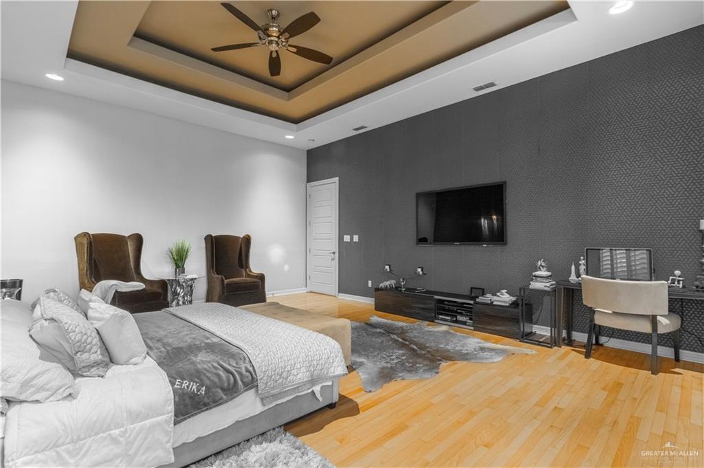 2806 Santa Laura Mission, TX 78572 - Photo 12 of 43 a bedroom with a bed and a flat screen tv