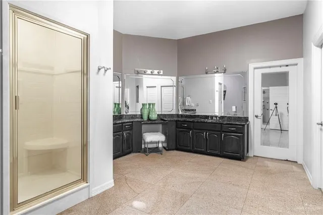 a kitchen with a refrigerator and a stove