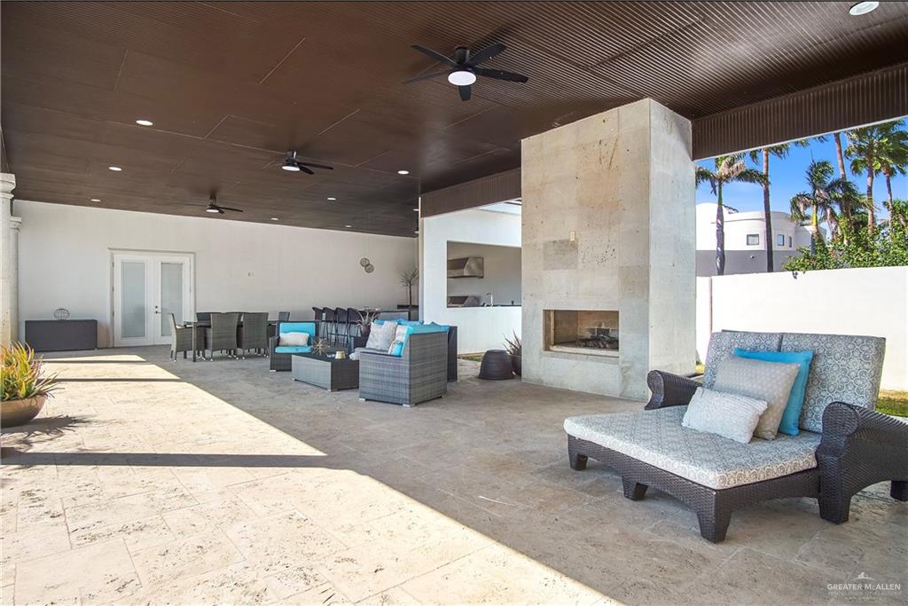 2806 Santa Laura Mission, TX 78572 - Photo 30 of 43 a living room with furniture and a fireplace