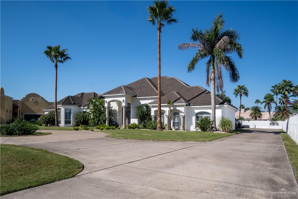 2806 Santa Laura Mission, TX 78572 - Photo 3 of 43 a front view of a house with palm trees