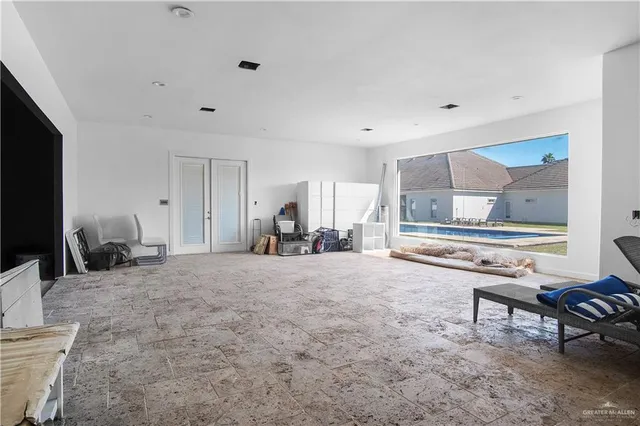 a bed room with furniture and a flat screen tv