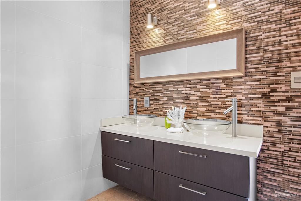 2806 Santa Laura Mission, TX 78572 - Photo 36 of 43 a bathroom with a sink and a mirror