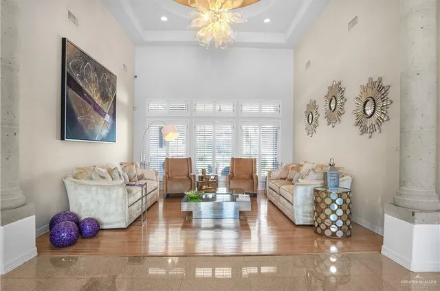 a living room with hard wood flooring and furniture