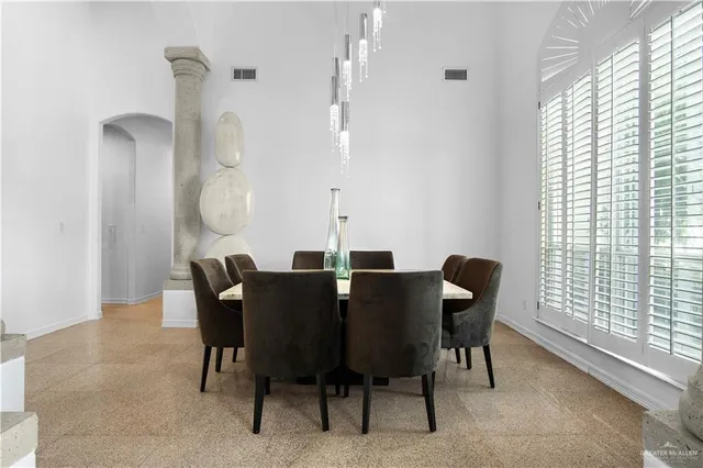 a view of a dining room with furniture and a window