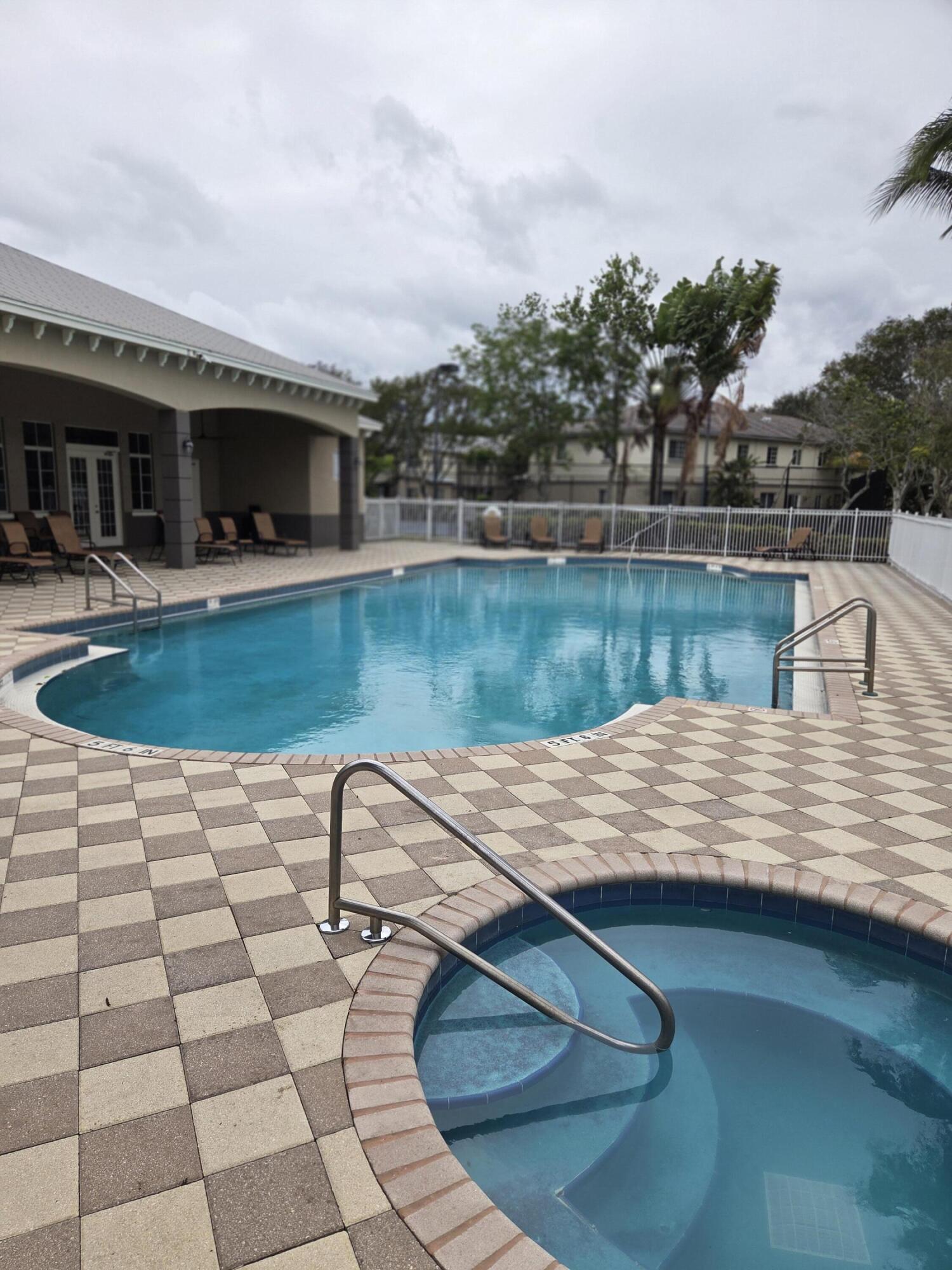 2035 Nassau Drive Riviera Beach, FL 33404 - Photo 14 of 14 Pool and clubhouse