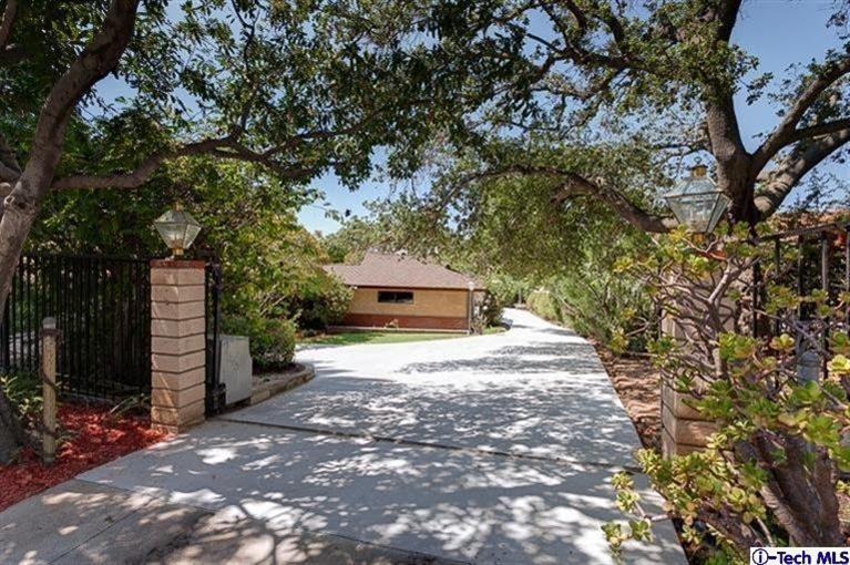 2238 Rim Road Bradbury, CA 91008 - Photo 2 of 27 a pathway of a house with a yard