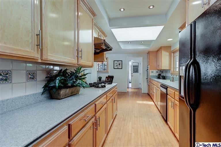 2238 Rim Road Bradbury, CA 91008 - Photo 11 of 27 a kitchen with sink a refrigerator and cabinets