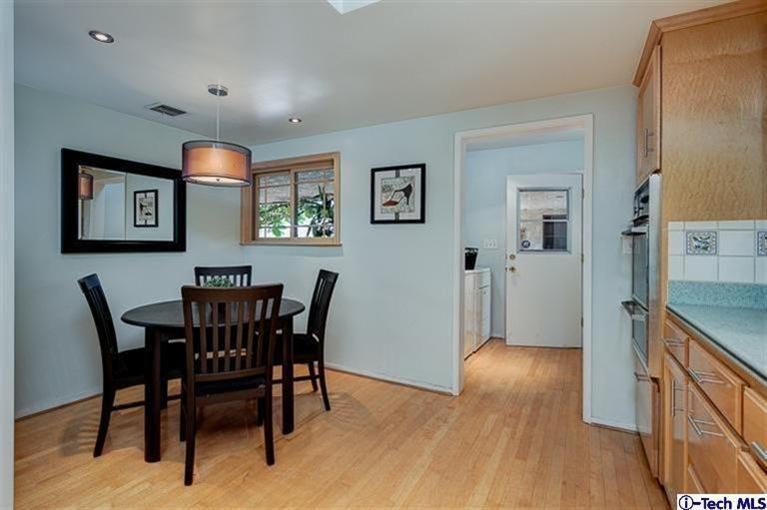 2238 Rim Road Bradbury, CA 91008 - Photo 12 of 27 a view of a dining room with furniture and wooden floor
