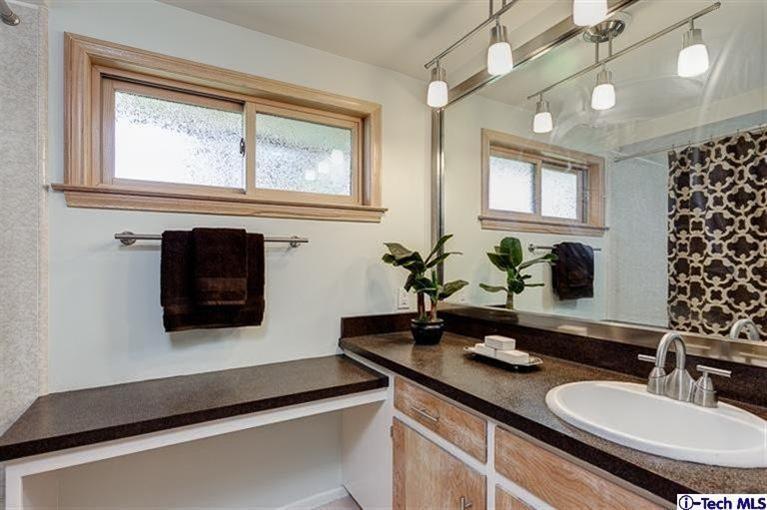 2238 Rim Road Bradbury, CA 91008 - Photo 19 of 27 a bathroom with a sink and a mirror