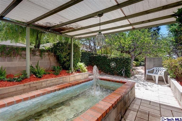 2238 Rim Road Bradbury, CA 91008 - Photo 25 of 27 a view of a backyard with a sitting area