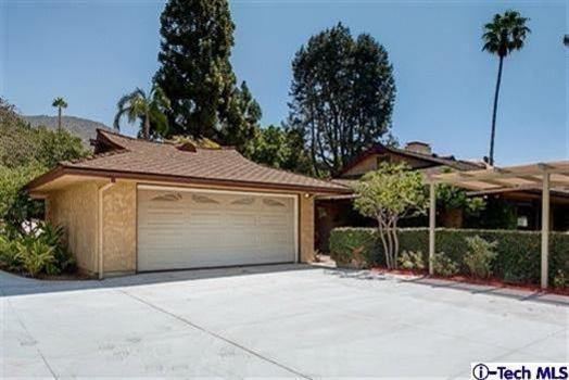 2238 Rim Road Bradbury, CA 91008 - Photo 27 of 27 a front view of a house with a yard and garage