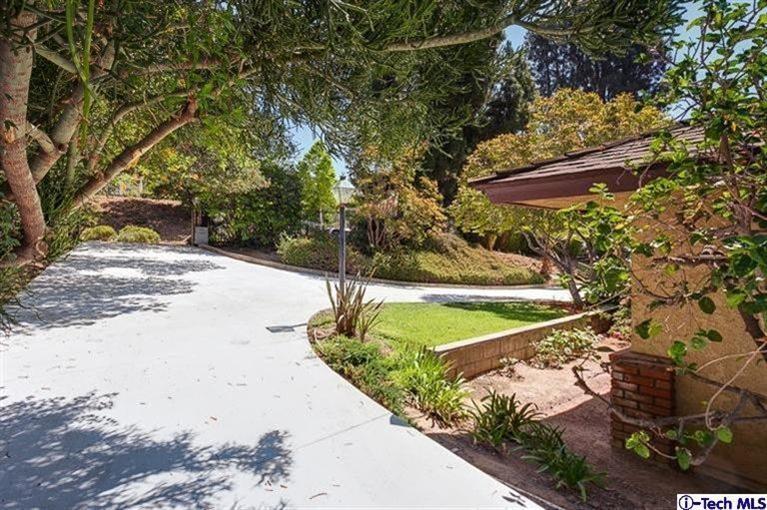 2238 Rim Road Bradbury, CA 91008 - Photo 4 of 27 a view of a yard with an tree