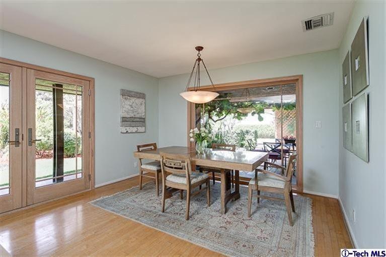 2238 Rim Road Bradbury, CA 91008 - Photo 8 of 27 a dining room with furniture a chandelier and wooden floor