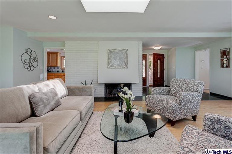 2238 Rim Road Bradbury, CA 91008 - Photo 9 of 27 a living room with furniture a rug and a lamp