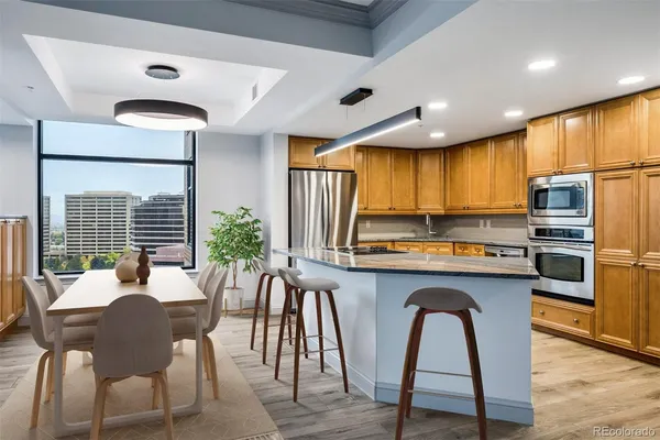 a kitchen with granite countertop cabinets and window