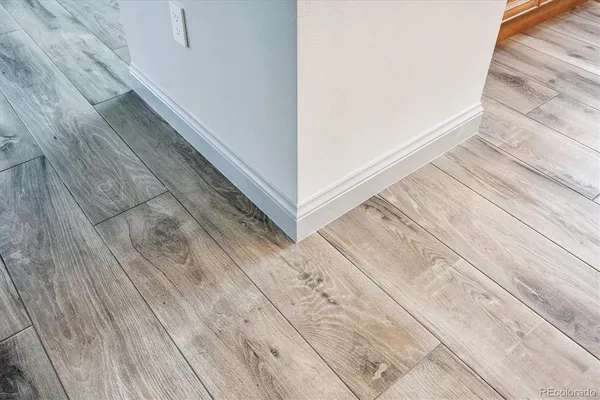 a living room with furniture and a lamp