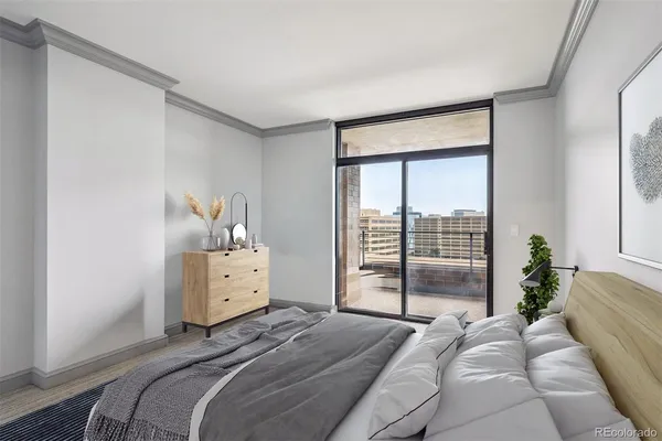 a room with a bed and wooden floor