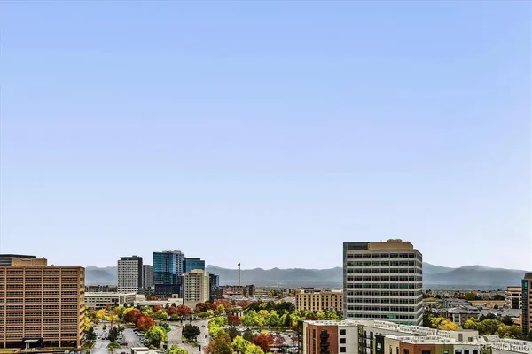 a view of a city with tall buildings