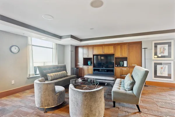 a large kitchen with a table and chairs
