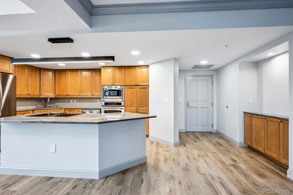 a kitchen with stainless steel appliances a sink and a stove