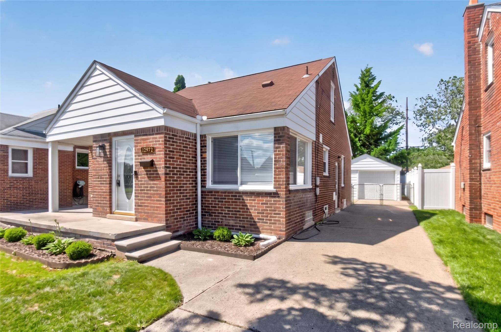 12972 Callender Street Southgate, MI 48195 - Photo 6 of 40 Brick exterior featuring white siding accents and a covered front porch