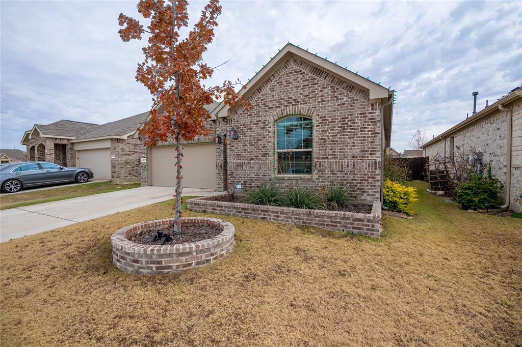 677 Ridgeback Trail Fort Worth, TX 76052 - Photo 2 of 40 a front view of a house with a yard