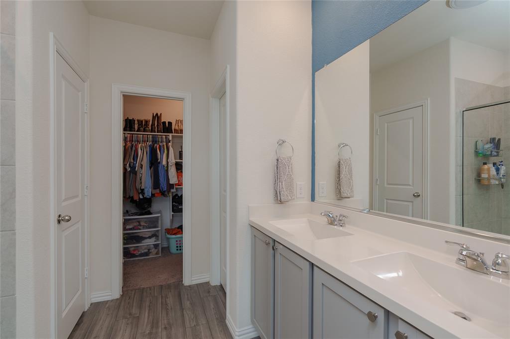 677 Ridgeback Trail Fort Worth, TX 76052 - Photo 26 of 40 a bathroom with a sink and a mirror
