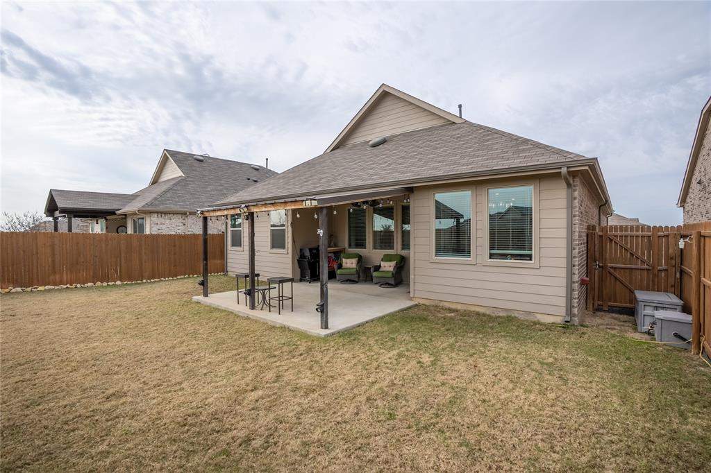 677 Ridgeback Trail Fort Worth, TX 76052 - Photo 34 of 40 a house view with a garden space