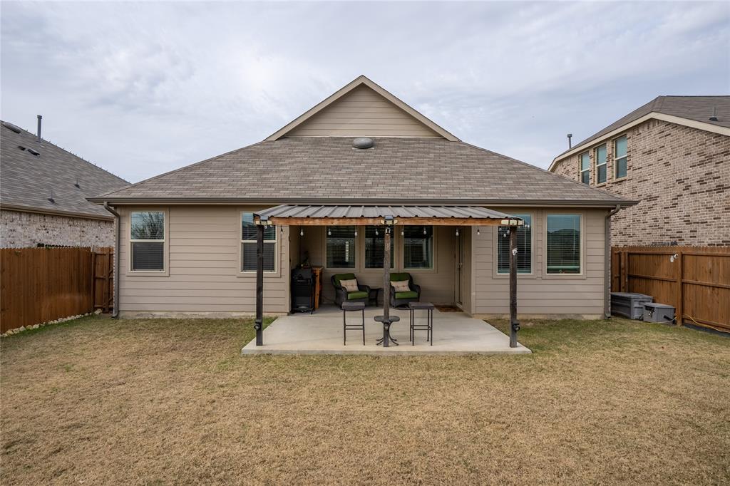 677 Ridgeback Trail Fort Worth, TX 76052 - Photo 35 of 40 a front view of a house with a yard and seating space