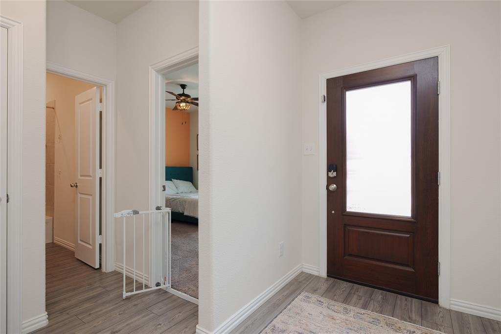 677 Ridgeback Trail Fort Worth, TX 76052 - Photo 6 of 40 wooden floor and closet in a room