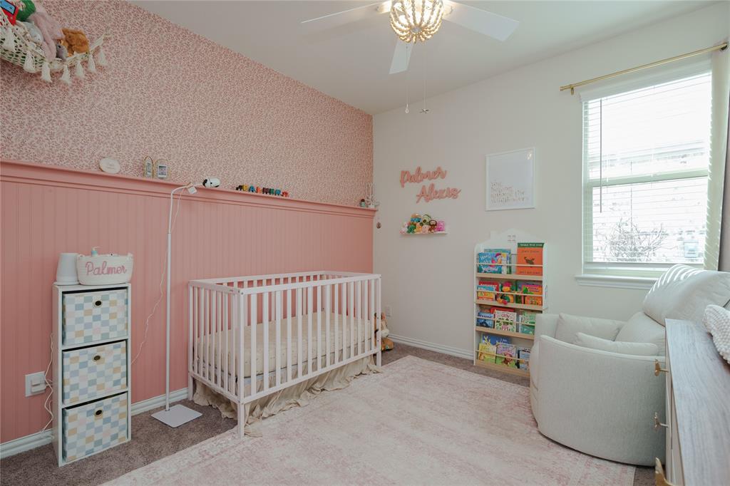 677 Ridgeback Trail Fort Worth, TX 76052 - Photo 9 of 40 a bedroom with furniture and a window
