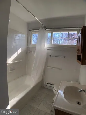 a bathroom with a sink and tub