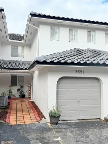 a front view of a house with a garage