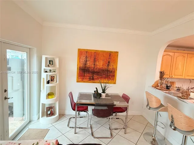 a living room with furniture a rug and a window