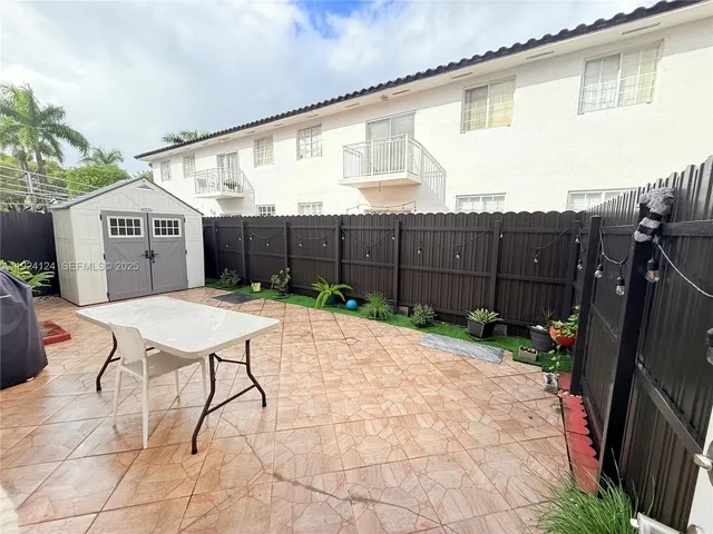 a garden view with a seating space