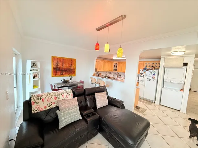a bedroom with furniture and a wooden floor