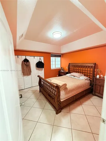 a bedroom with a bed and utility room