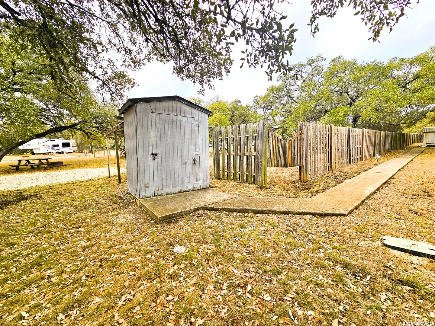 605 Lakeshore Lane Bandera, TX 78003 - Photo 14 of 32 a view of a house with a wooden fence