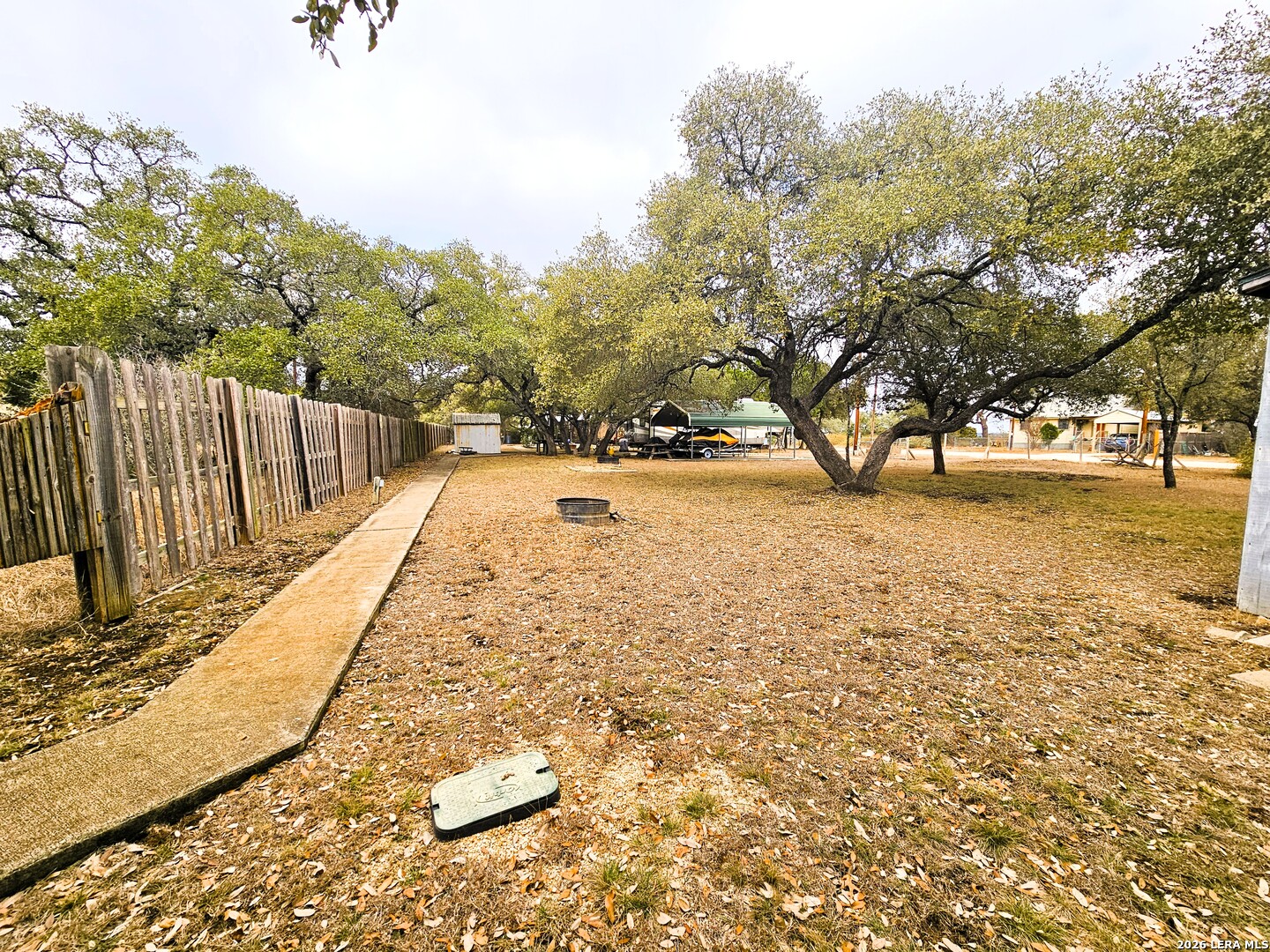 605 Lakeshore Lane Bandera, TX 78003 - Photo 15 of 32 a view of backyard with wooden fence