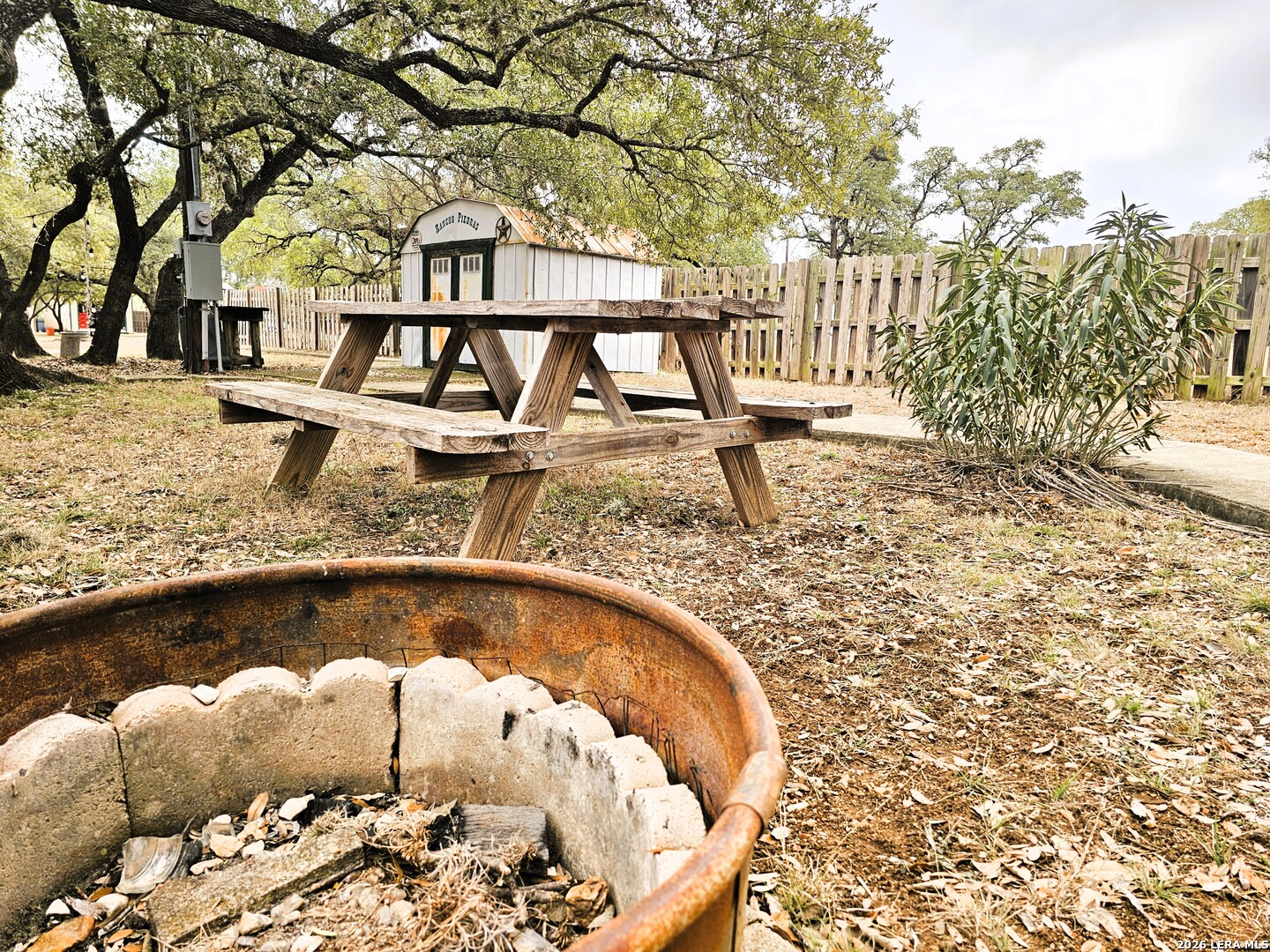 605 Lakeshore Lane Bandera, TX 78003 - Photo 17 of 32 a view of a fountain in the middle of a yard